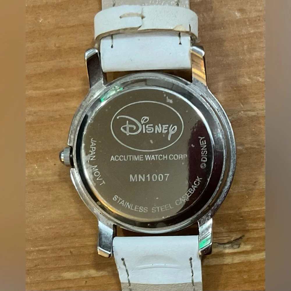 Disney: Woman’s Disney Minnie Mouse glitter floating hearts white wrist watch.